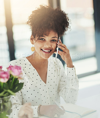 Buy stock photo Shot of a young businesswoman talking on her cellphone