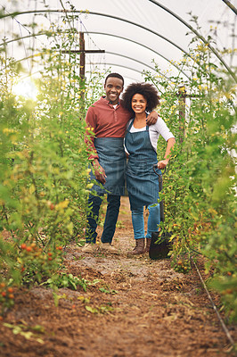 Buy stock photo Full length portrait of a young farm couple standing in one of their vineyards