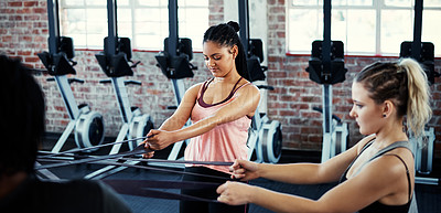 Buy stock photo Cropped shot of women working out with resistance bands