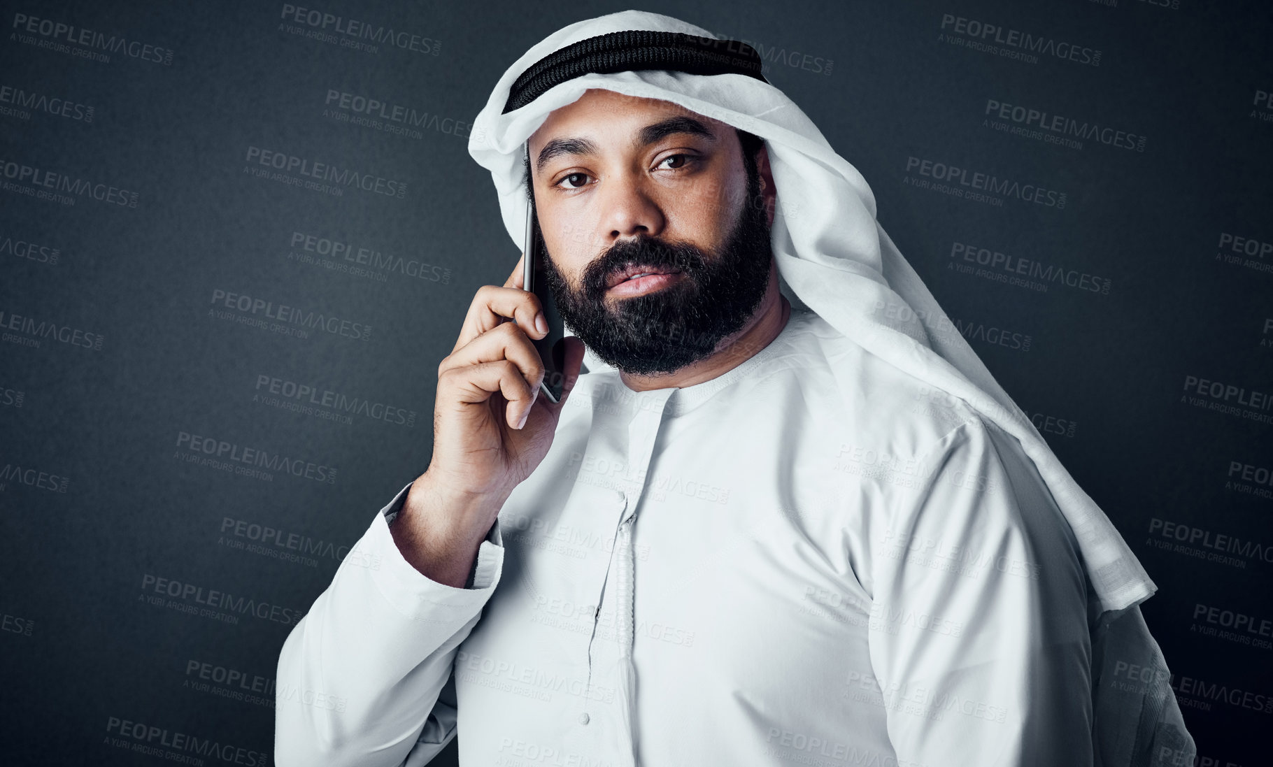 Buy stock photo Muslim man, portrait and phone call in studio for networking, business proposal or planning deal terms. Negotiation, advisor or Arab person with mobile for contract mediation, talk or dark background