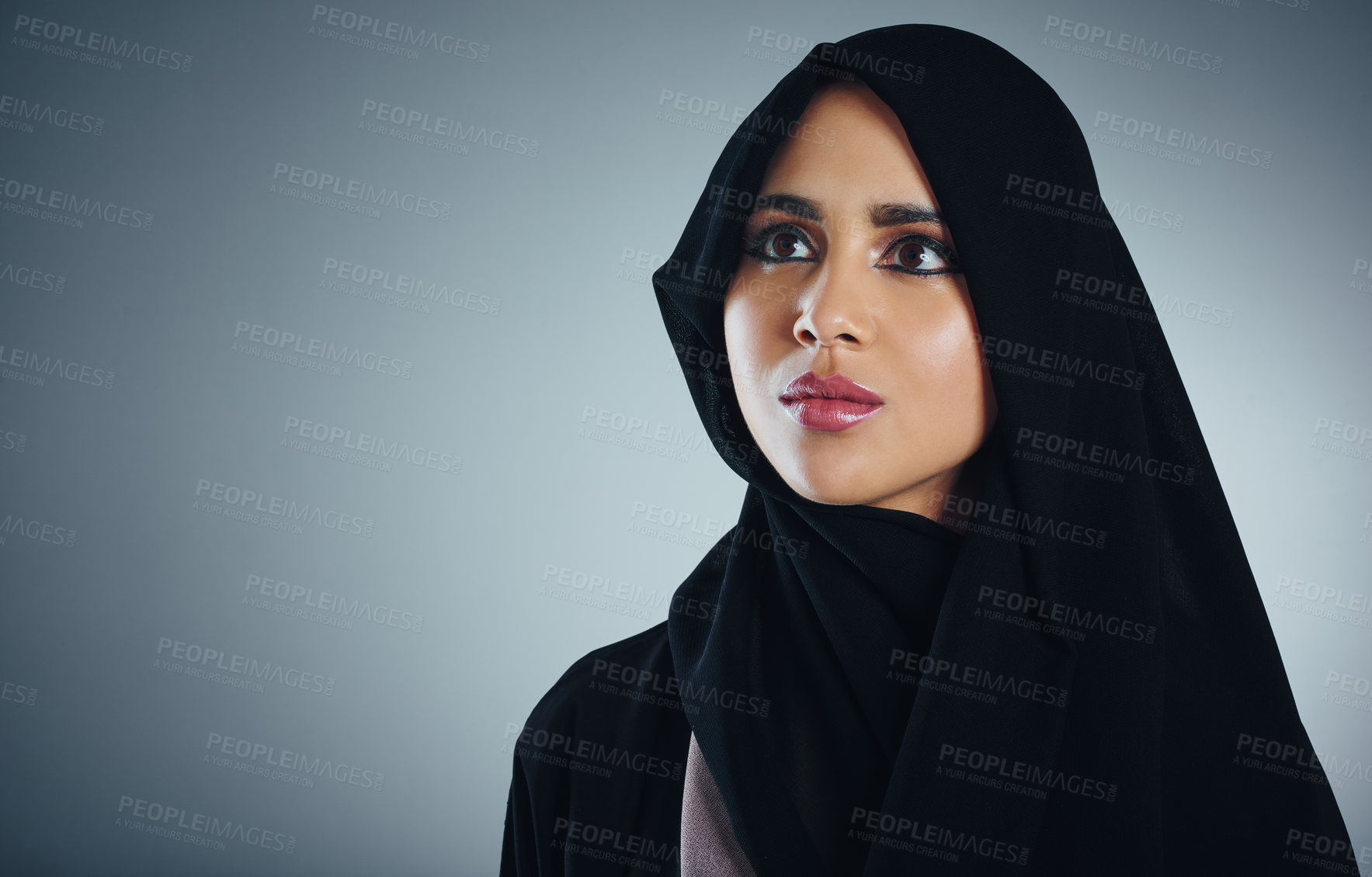 Buy stock photo Studio shot of a young muslim businesswoman against a grey background