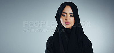 Buy stock photo Studio shot of a young muslim businesswoman against a grey background