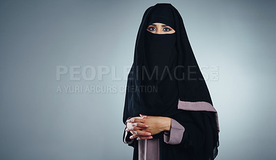 Buy stock photo Studio portrait of a young muslim businesswoman against a grey background