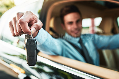 Buy stock photo Shot of a businessman holding the keys to a new car