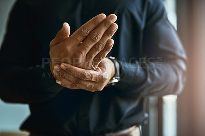 Buy stock photo Closeup shot of an unidentifiable businessman suffering with pain in his hands