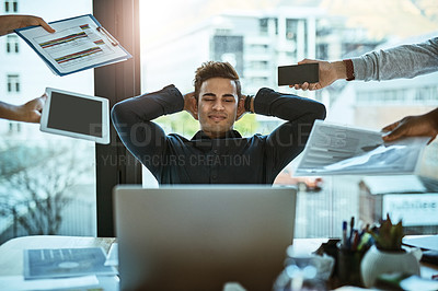 Buy stock photo Shot of a young businessman looking calm in a demanding office environment