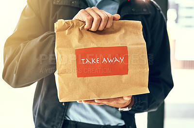 Buy stock photo Closeup shot of an unidentifiable delivery man holding a restaurant takeaway