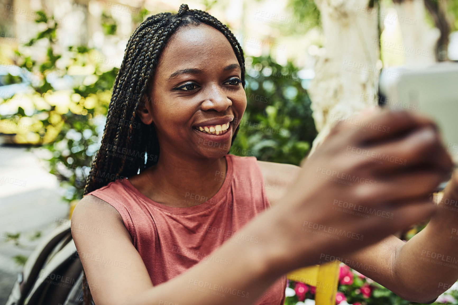 Buy stock photo Cropped shot of a young woman taking a selfie while out for lunch