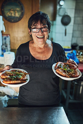 Buy stock photo Cropped shot of a mature woman working in a restaurant