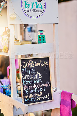 Buy stock photo Shot of a baked goods stall with a variety of goods to choose from and written down on a chalk board