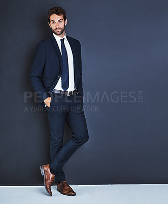 Buy stock photo Portrait, fashion and a mockup with a business man in studio on a blue background for contemporary corporate style. Success, professional and a confident male employee in a suit for executive power