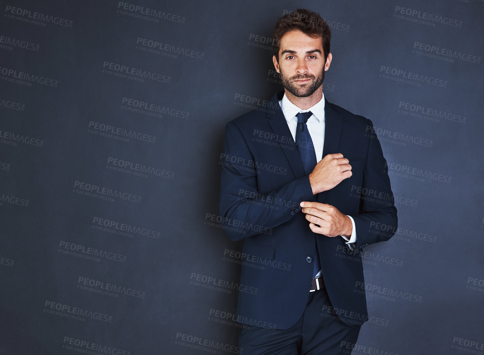 Buy stock photo Portrait, mockup and a formal business man in studio on a blue background for corporate fashion on mock up space. Success, professional and confident young male employee in a suit for executive style
