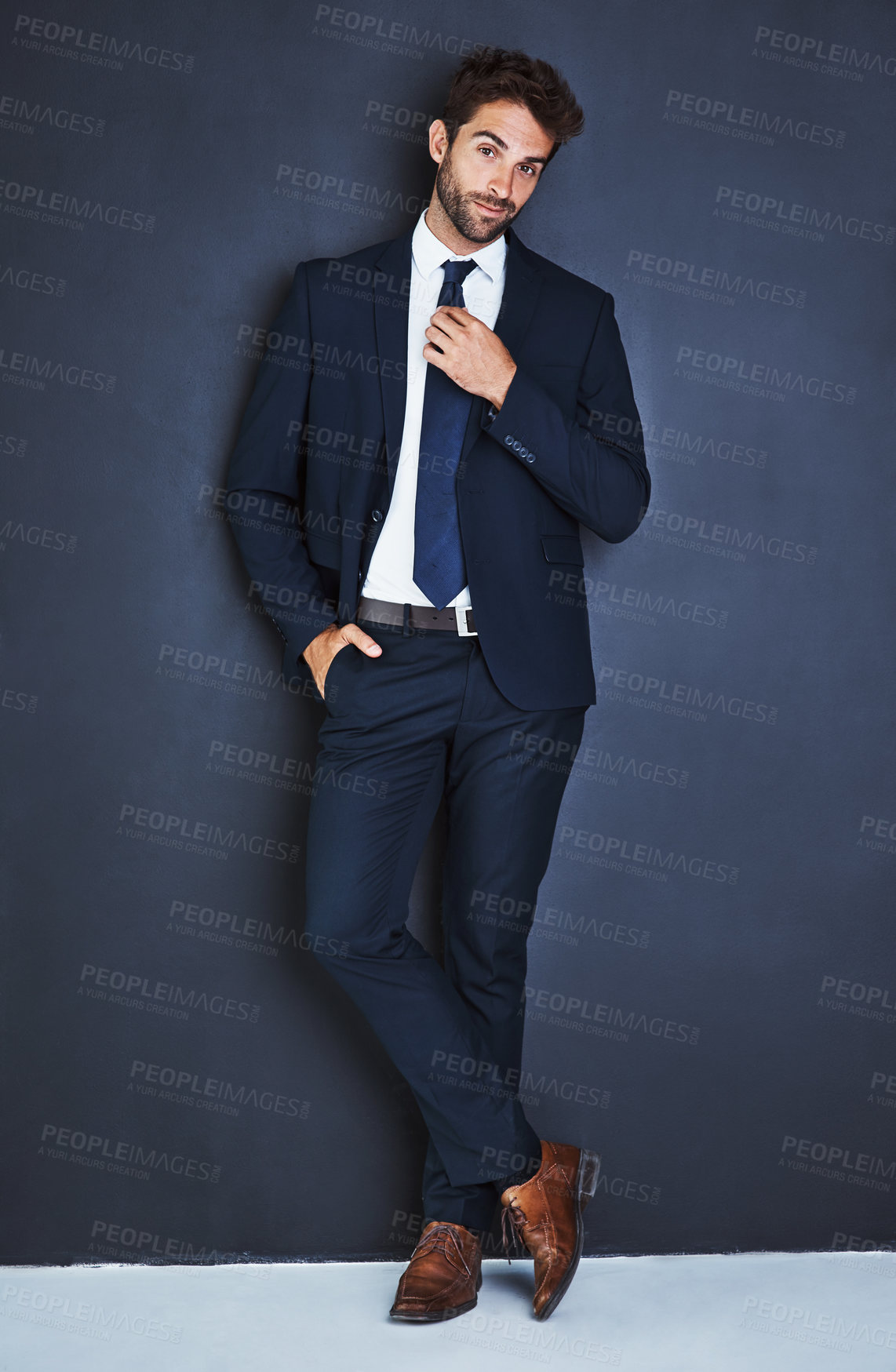 Buy stock photo Portrait, fashion and a corporate business man in studio on a grey background mockup for executive style. Success, professional and a confident young male employee in a suit for formal mock up power