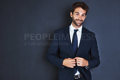 Buy stock photo Portrait, smile and mockup with a business man in studio on a blue background for contemporary corporate style. Success, professional and a confident male employee in a suit for executive fashion