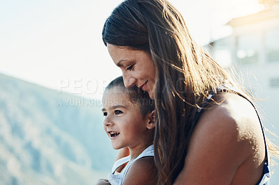 Buy stock photo Outdoor, hug and mother with child for bonding, connection and family time together with happiness. Smile, relax and mom holding and embracing kid with care, love and sweet moment in backyard of home