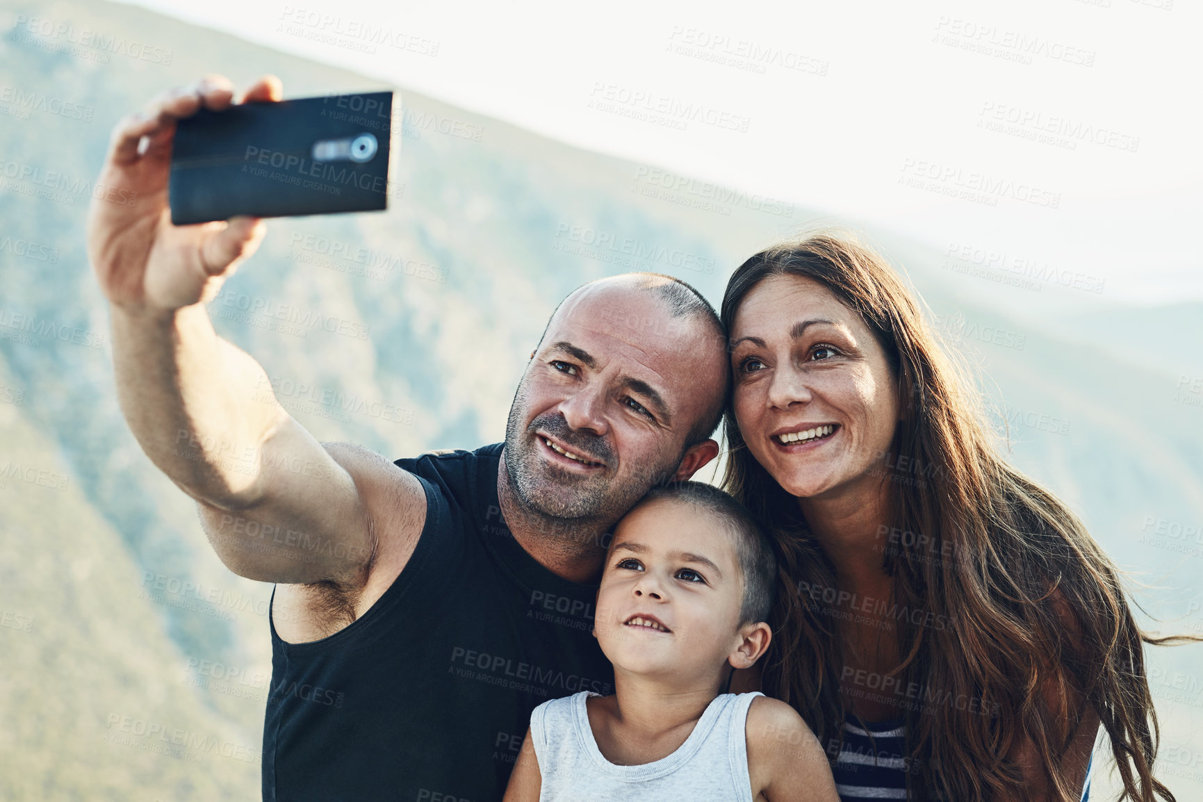 Buy stock photo Outdoor, family and hug in nature selfie, photography and love for memory on vacation in Switzerland. Parents, boy and trust for attention or affection, social media post and support kid with care