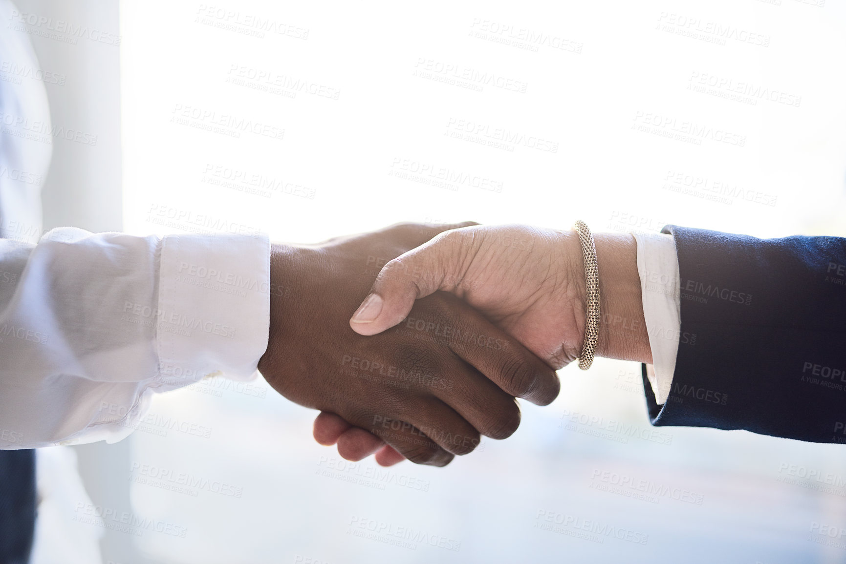 Buy stock photo Shot of two unrecognizable businesspeople shaking hands in agreement