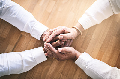 Buy stock photo Shot of two unrecognizable people holding hands in support for each other