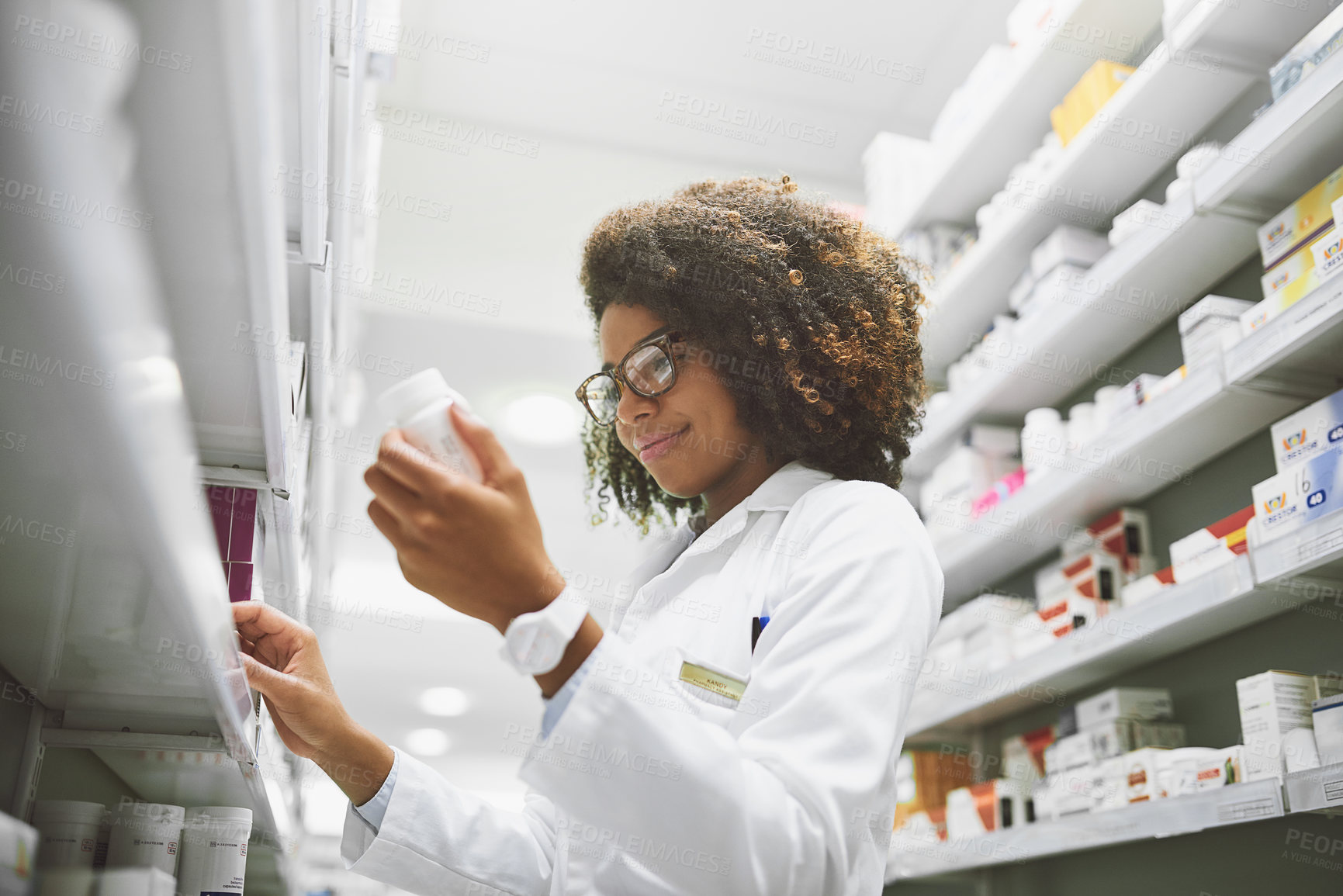 Buy stock photo Woman, wellness and pills with pharmacy check, medical career or healthcare service with zoom. Female pharmacist, workplace and package inspection for inventory, prescription stock in drug store