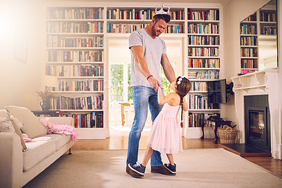 Buy stock photo Shot of a father bonding with his little daughter at home