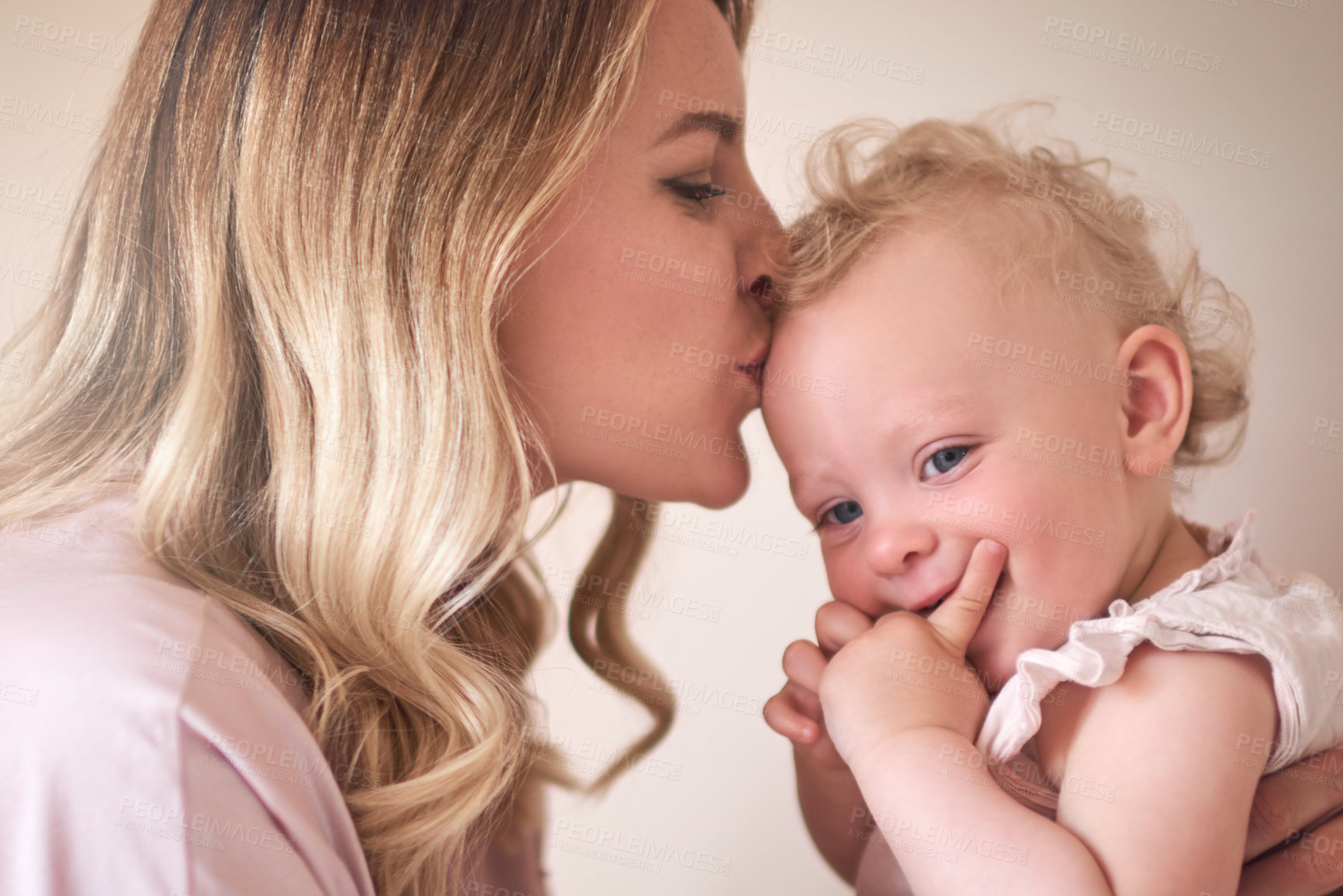 Buy stock photo Happy, mother and kiss forehead of baby for love, bonding together and family security at house. Woman, affection and child care with embracing for kid development, calm morning and growth support