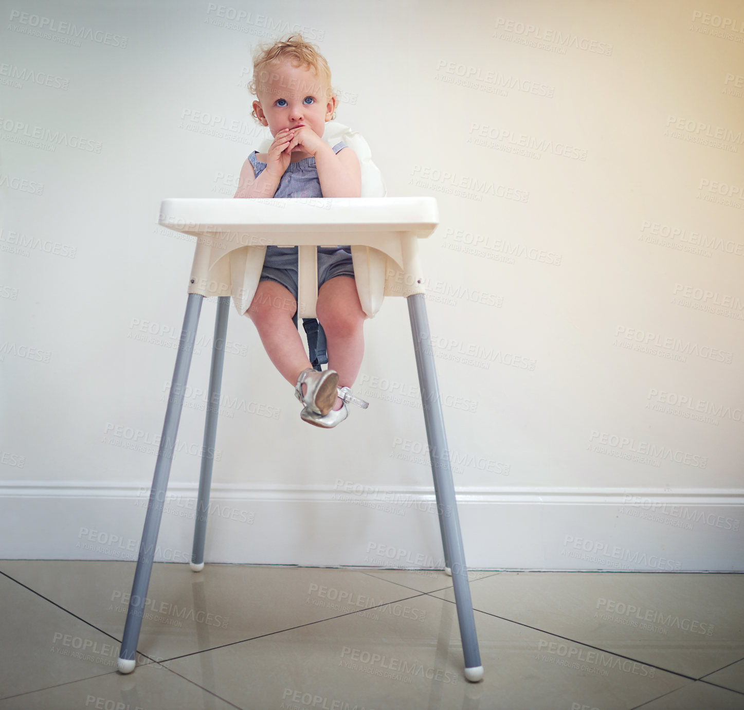 Buy stock photo Baby, girl and high chair in home for development, comfort and meal or eating time as safety. Toddler, furniture and young female kid in apartment for growth, learning and support on wall background