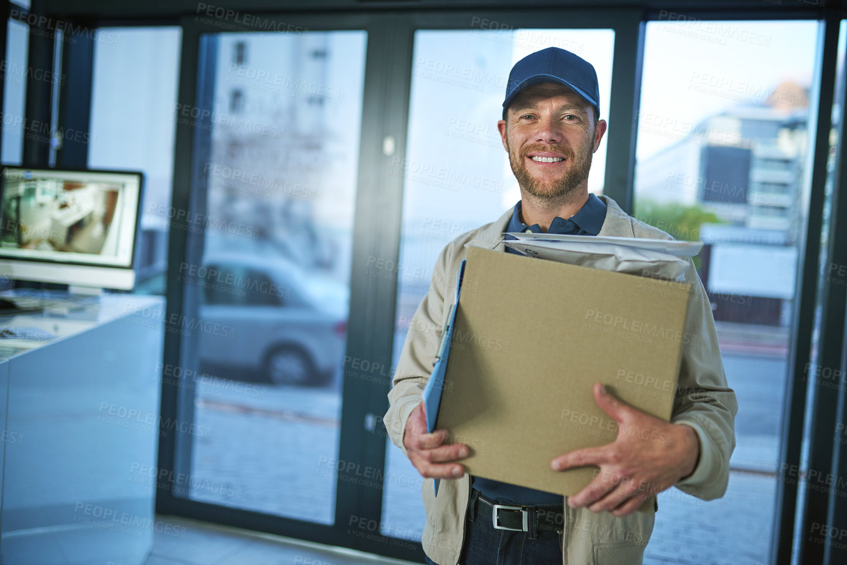 Buy stock photo Shot of a young man making a home delivery