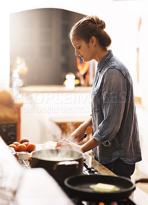 Buy stock photo Cooking, food and woman with a pan in the kitchen for lunch, dinner or supper in a modern house. Diet, wellness and female chef preparing a healthy meal recipe in a pot on a stove at her home.