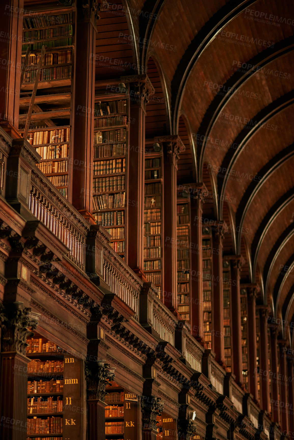 Buy stock photo Cropped shot of a large, vintage library full of books