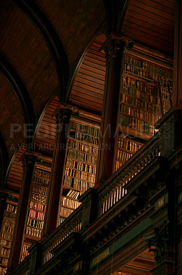 Buy stock photo Library, below and arches at books for knowledge, education and architecture in Dublin. Literature, design and order in shelves for research, category and fictional novels in archive collection