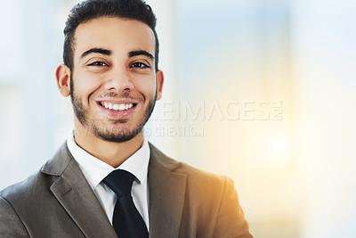 Buy stock photo Portrait of a confident young businessman standing in an office
