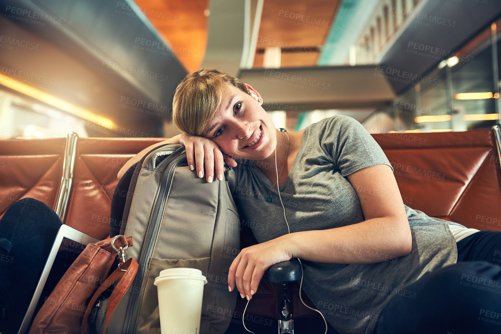 Buy stock photo Happy woman, portrait and music with earphones at airport in waiting room for flight, departure or travel. Young, female person or tourist with smile or headphones for trip or delay in netherlands