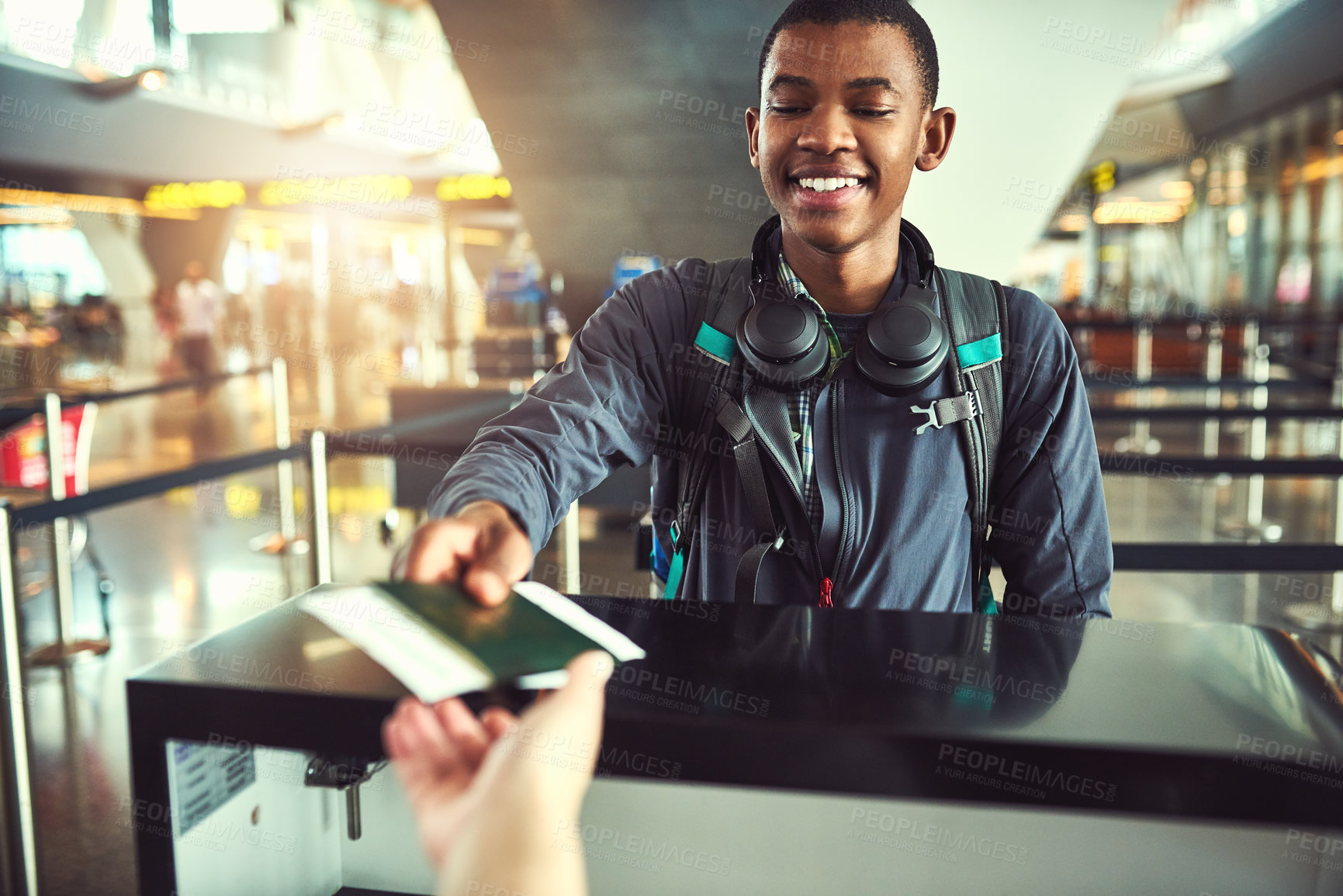 Buy stock photo Black man, airport and smile with passport at help desk for journey, travel and boarding. Female person, tourist and happy for ticket or document as identity check on flight for holiday and adventure