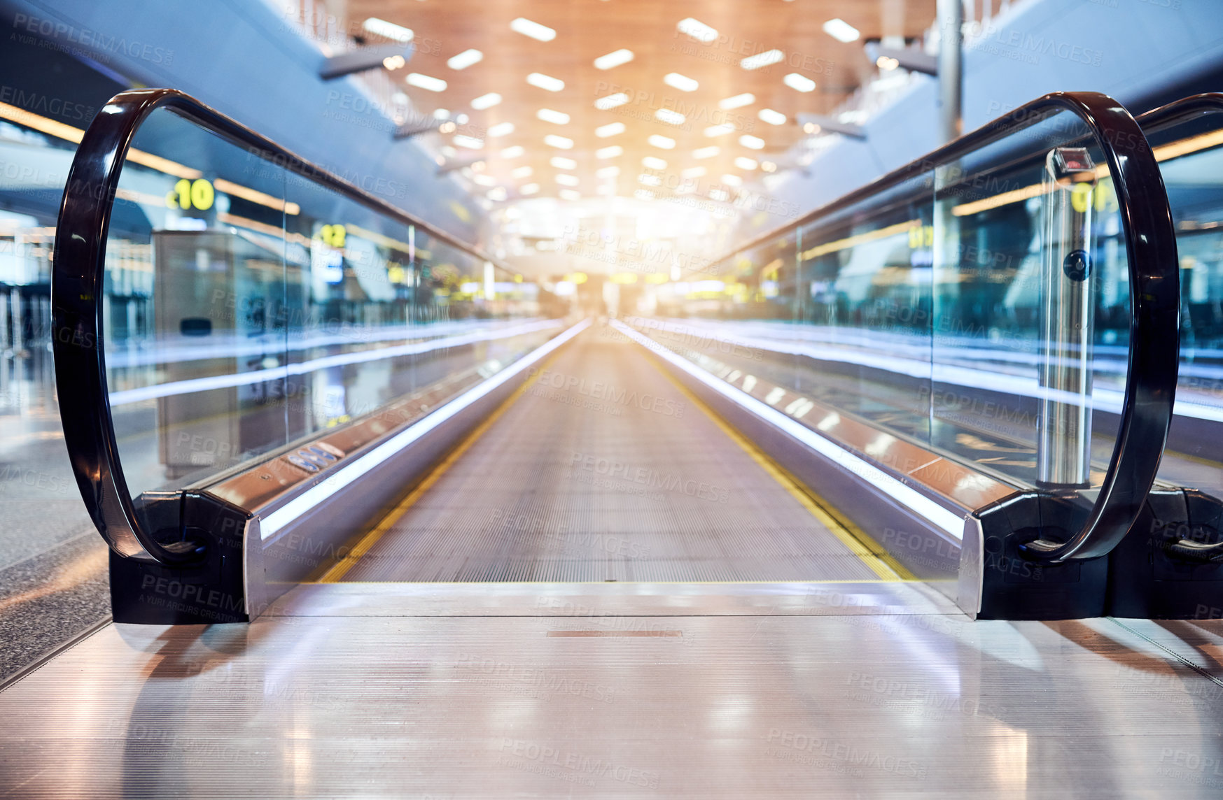 Buy stock photo Escalator, lens flare and airport building for morning travel, journey or stairway entrance for flight, departure or arrival. Interior, machine or moving steps at empty modern shopping mall or office