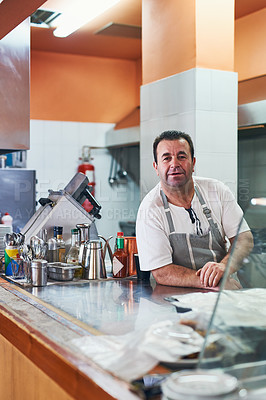 Buy stock photo Shot of a man working at a restaurant