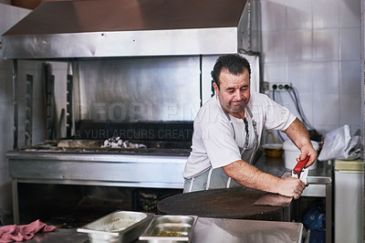 Buy stock photo Shot of a man working at a restaurant