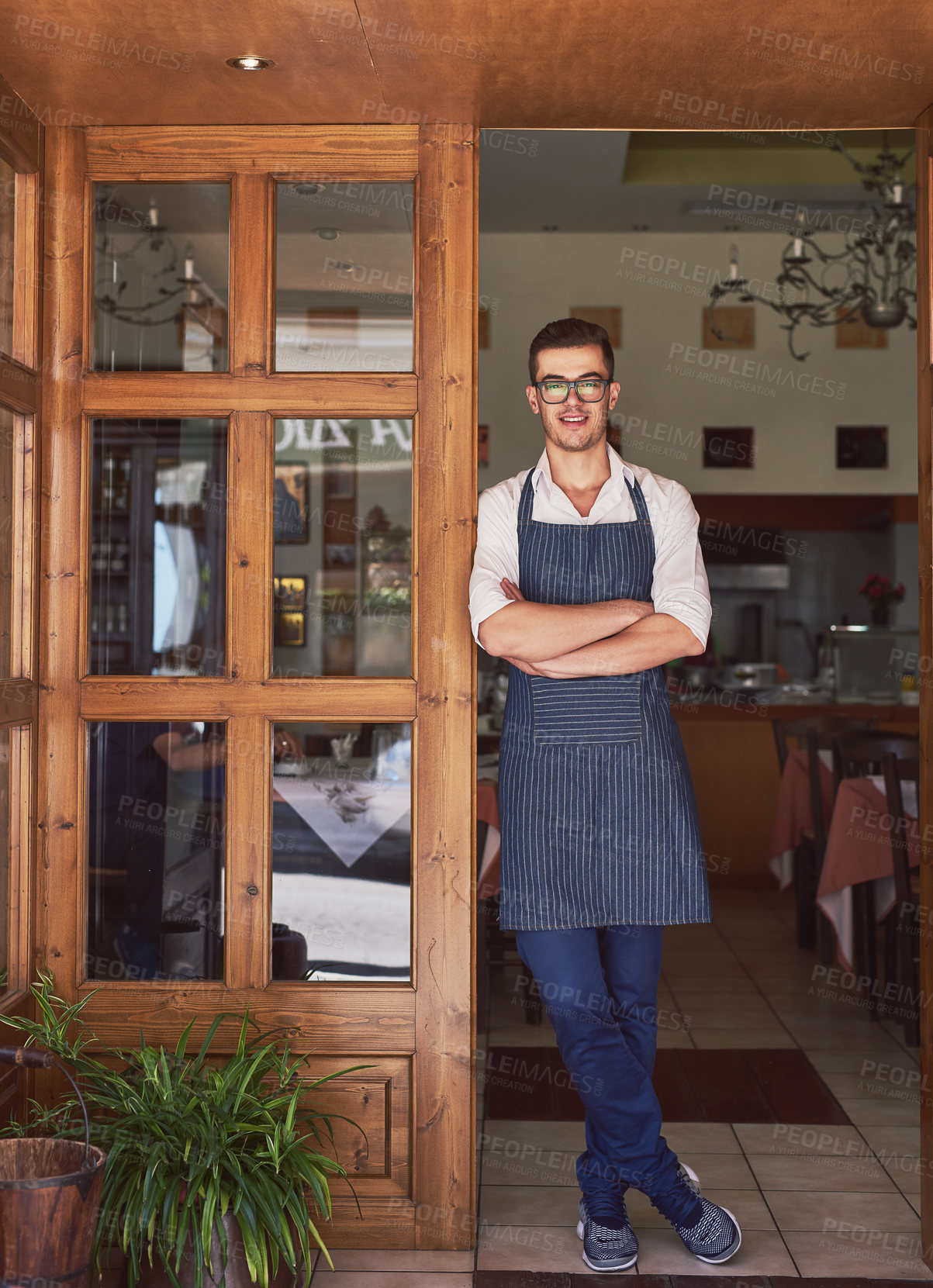 Buy stock photo Shot of a man working at a restaurant