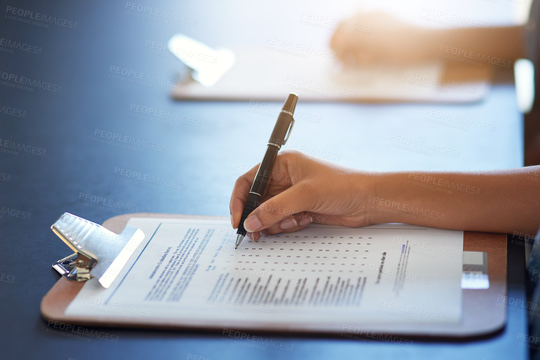 Buy stock photo Clipboard, hands and writing on document with pen for survey on table mockup. Filling in paperwork, questions and woman with application form, checklist or test, examination and review for assessment