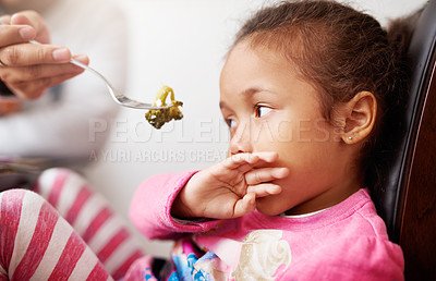 Buy stock photo Shot of a little girl refusing to eat her food