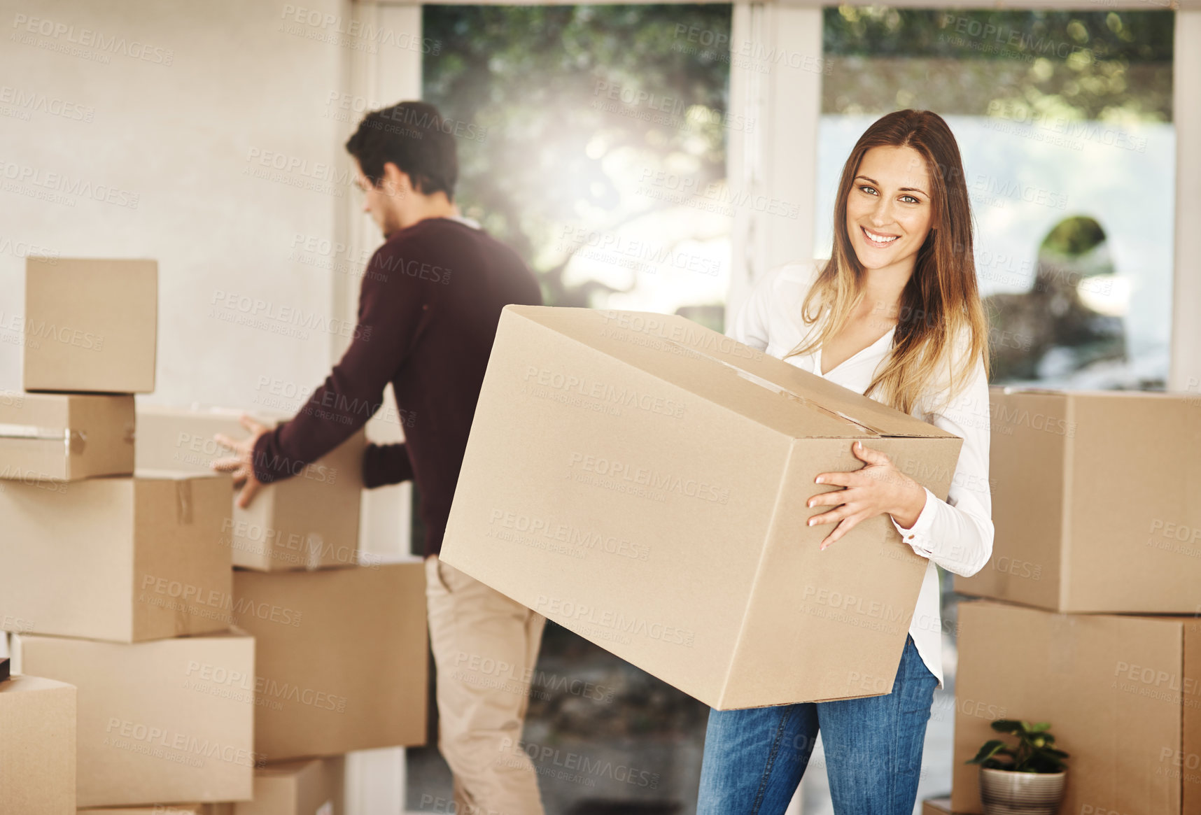 Buy stock photo Cardboard, couple and boxes with moving to new home for real estate, mortgage or property investment. Happiness, homeowner and exited woman with man for packing, fresh start or relocating to Denmark