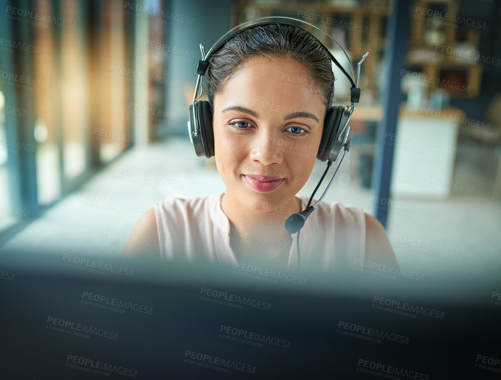 Buy stock photo Shot of a young woman working in a call center