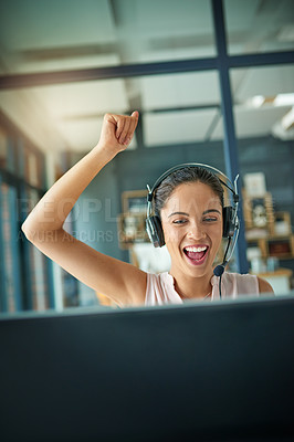 Buy stock photo Shot of a young woman working in a call center and cheering
