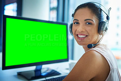 Buy stock photo Shot of a young woman using a computer with a green screen in a call center