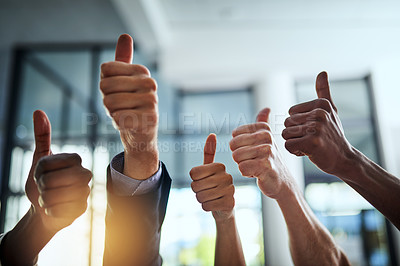 Buy stock photo Diverse group of successful businesspeople approving and giving thumbs up for satisfaction and job well done. Corporate team of cheerful colleagues using their hands to say yes showing agreement