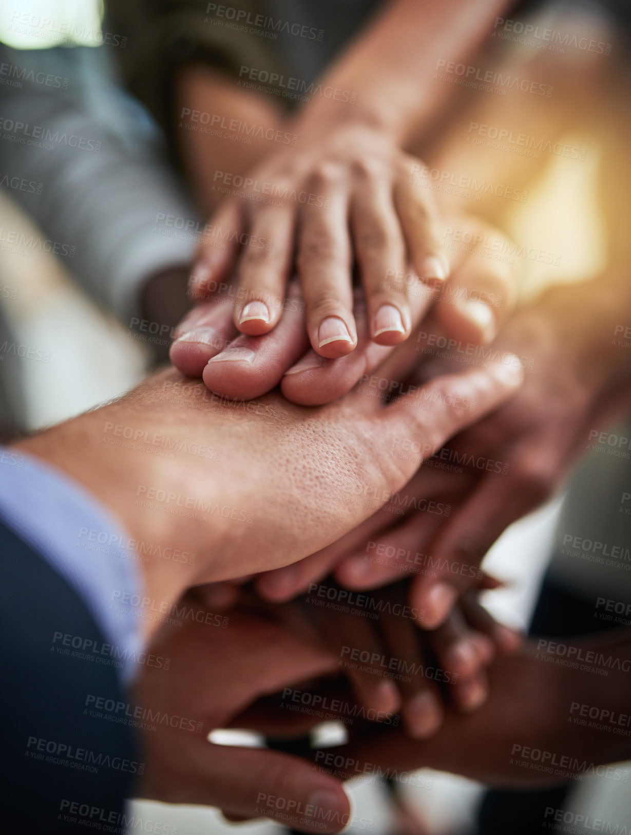 Buy stock photo Cropped shot of a group of businesspeople joining their hands in solidarity