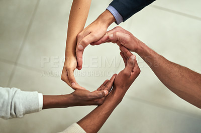 Buy stock photo Group of businesspeople hands making creative circle shape together in an office at work. Above diverse business professionals support, motivate and unity during a meeting in a corporate office