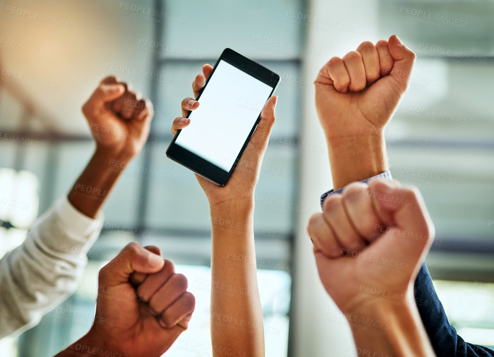 Buy stock photo Hands of business people cheering and celebrating good news on a phone with blank screen for copy space inside. Excited team of office workers showing hand gesture for success, victory and winning