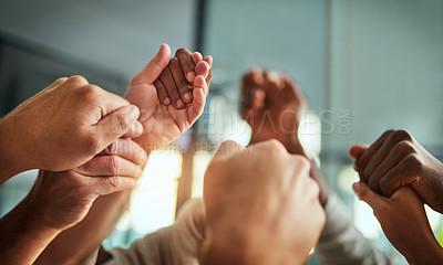 Buy stock photo Diverse people holding hands in teamwork, success and support while showing solidarity, trust and unity in office. Closeup of business team, men and women standing together for equal workplace rights
