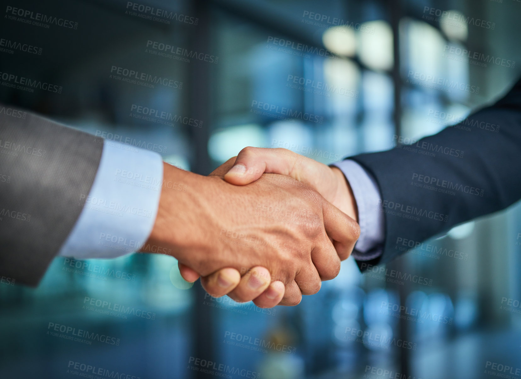 Buy stock photo Handshake and teamwork with hands of two corporate and professional business colleagues or coworkers. An agreement, deal or partnership between merging companies to unite together and achieve success