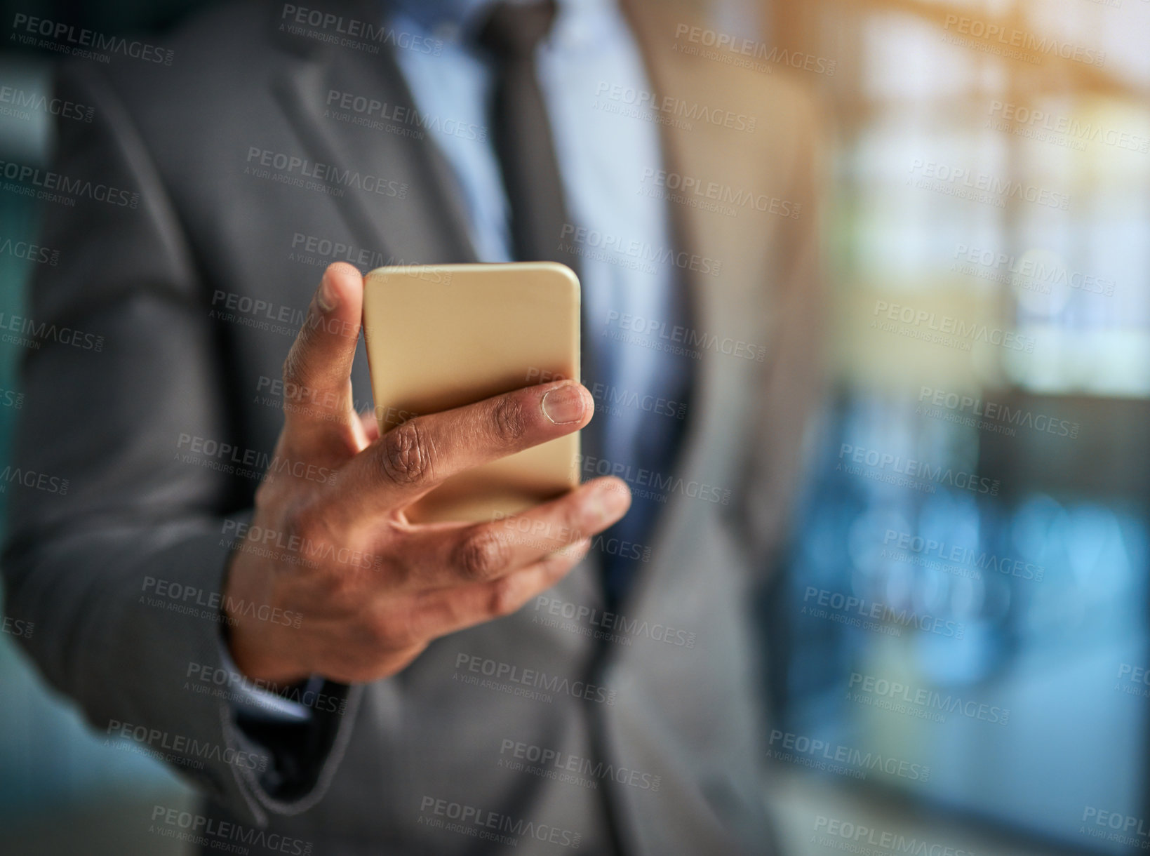 Buy stock photo Business, phone and hand of a professional man typing a message, browsing online and using a mobile app to communicate. Closeup of male entrepreneur using internet and social media for marketing